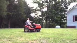 Levi's first riding lawn mower experience flying solo.