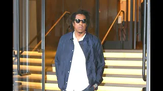 Jay Z leaves his roc nation  office & signs autographs before getting into his SUV in New York City