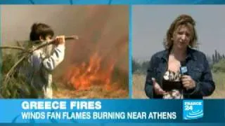 Thousands flee their homes as wildfires rage near Athens