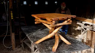 Rustic crossed legs table by Uudopuu