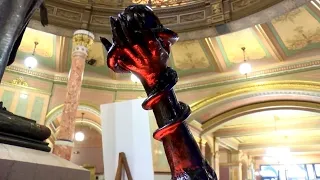 Satanic Temple statue neighbors nativity scene at Illinois State Capitol