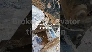 a broken compact Hyundai excavator thumb pin