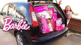 Car trunk full of Barbie dolls