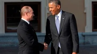 Obama and Putin greet with long handshake