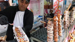 Bubble Waffles covered in Chocolate and Sweets. London Street Food