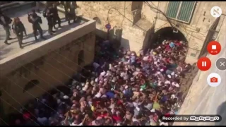 Policemen throwing stun grenades at worshipers in Jerusalem old city