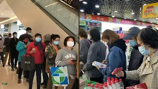 Massive queue at supermarket in Shanghai as Covid cases surge | AFP