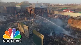 Aerial Footage Shows Wildfire Devastation Amid Unusually Warm Weather In Russia | NBC News NOW