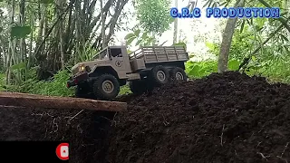 offroad adventure with a military truck across a wooden bridge