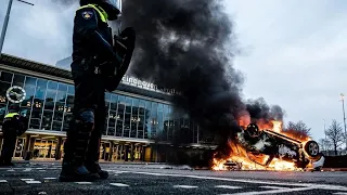 Dutch police clash with anti-curfew protesters, amid looting and vandalism