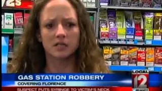 Suspect Puts Syringe to Victim's Neck in Robbery