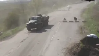 A Russian Mi-17 Helicopter Gunship Crew Providing Air Cover For a Russian Convoy / Location Unknown