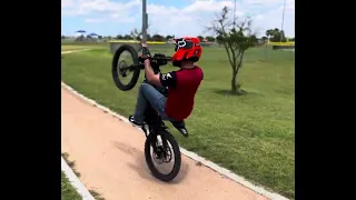 Super slow Surron wheelie