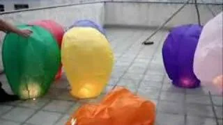 Mix Colored Sky Lanterns taking off in a group