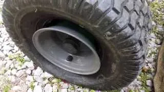 fixing a lawn mower tire that popped off the wheel