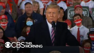 President Trump praises his COVID-19 response at largely maskless outdoor rally