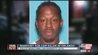 Orlando police officer shot and killed, suspect on the run