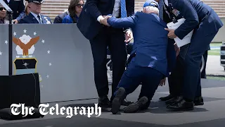 Joe Biden falls over at US Air Force Academy graduation ceremony