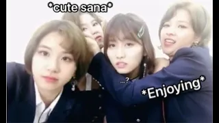 Jeongyeon playing with Sana’s cheeks