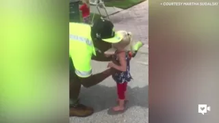 Toddler triplets and garbage men are BFFs