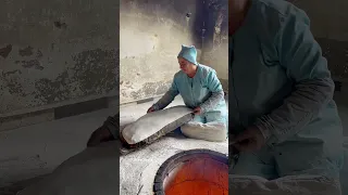 Baking Armenian lavash bread in traditional way