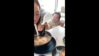 Cute baby can't stop drooling when watching mom eat Pho noodles #shorts