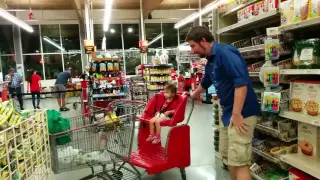 Baby Girl Going Full Speed in Shopping Cart at Grocery Store