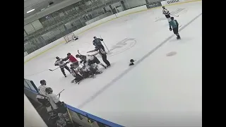 Beer league hockey player kicks opponent with skate