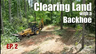 Clearing Land with a backhoe part 2