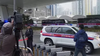 Van believed to be carrying Hong Kong activist and publisher Jimmy Lai arrives at court