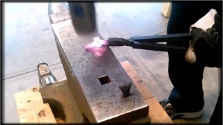 Blacksmith Forging A Split Cross