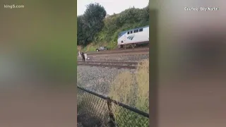 Amtrak train stops just in time to avoid Jeep stuck on the tracks in Edmonds