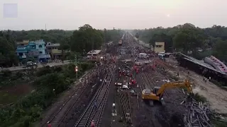 Drone footage shows work underway to restores rail line after crash