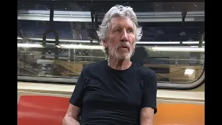 Roger Waters rides the subway [phone portrait ratio]