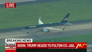 Former President Trump's plane touches down at Atlanta airport
