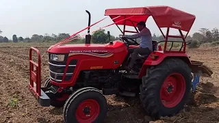 Mahindra yuvo tech + tractor on  plough.