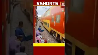 😳 WATCH: Woman Escapes Shocking Clash With Speedy Train #shorts #viralvideo