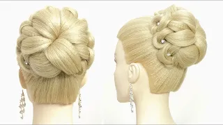 High bun hairstyle for long hair. Wedding prom updo