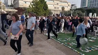 People hurry for shelter in Tel Aviv as sirens sound after rockets launched from Gaza
