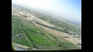 C-130 makes an assault landing on bomb damaged runway in Afghanistan