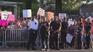 Hundreds of Queens residents stage boisterous migrant center protest