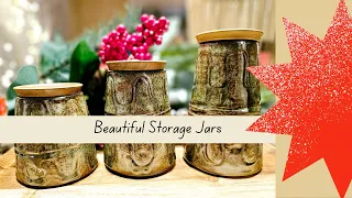 Three ceramic jars with lids