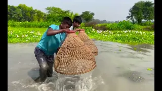 Two boys are polo fishing in the village
