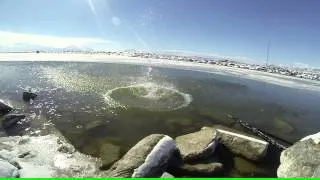 Slow motion throwing rock into water