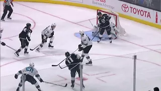 Kings' Brown tips a Kopitar shot past Sharks' Jones for opening goal