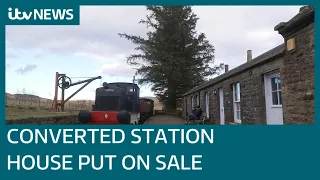 Converted station house cottage with its own train put up for sale | ITV News
