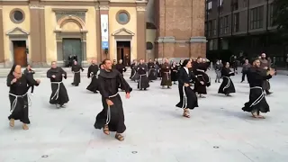 People dressed as monks dancing to Jerusalema