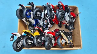 Box Full of Various Motorcycles of Different Brands and Types