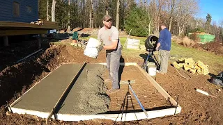 Pouring a concrete slab by hand