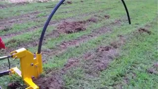 Implements Direct Single tine ripper with pipe laying attachment demo